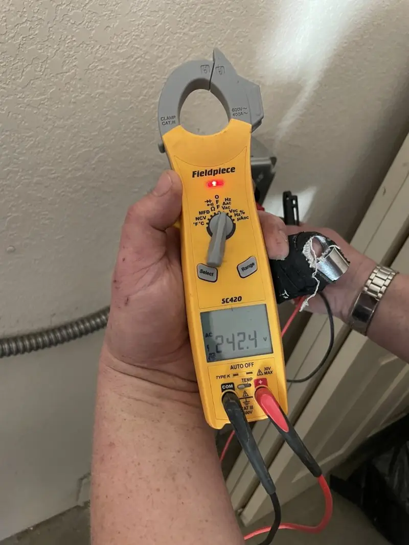 Voltage testing with clamp meter during Outlet Installation in Prosper